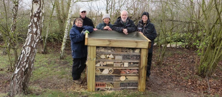 Volunteers and ranger with the new bug hotel